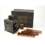Ernst Plank magic lantern with black japanned body, brass chimney and lion paw feet, in original ebo
