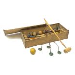 Table top wooden croquet set in the Victorian style with eight coloured mallets, eight corresponding