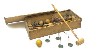 Table top wooden croquet set in the Victorian style with eight coloured mallets, eight corresponding