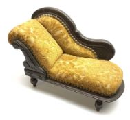 Late 19th/early 20th century doll's chaise longue with mahogany stained carved frame, scrolling back