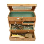 An engineers seven drawer tool chest with some tools,