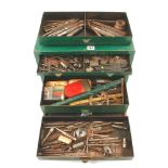 A four drawer metal tool box with various engineers tools G