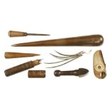 Sailmaker's tools ie. 17" lignum fid and another in boxwood, needle case with needles, palm, pricker