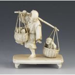 A fine quality 4 1/2" ivory okimono of a fisherman returning home with his catch, his son disturbing