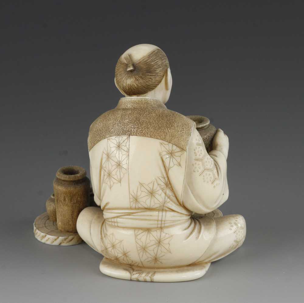 A 4" ivory okimono of a potter at his wheel - Image 4 of 5