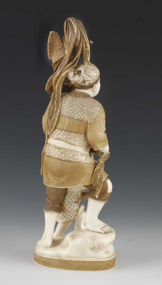 A 9" ivory okimono of a long tailed bird stealing grapes from a father and son - Image 3 of 5