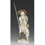 An 8" ivory okimono of a fisherman and his son signed