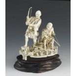 A fine ivory okimono of two fishermen signed Gyokuzan 5" x 6"