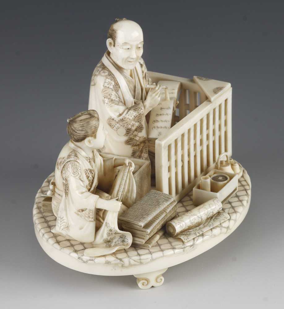 A fine ivory okimono of a draper taking notes as his apprentice measures the cloth 5" x 4" - Image 4 of 5
