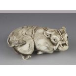 A 3" ivory netsuke of a recumbent ox