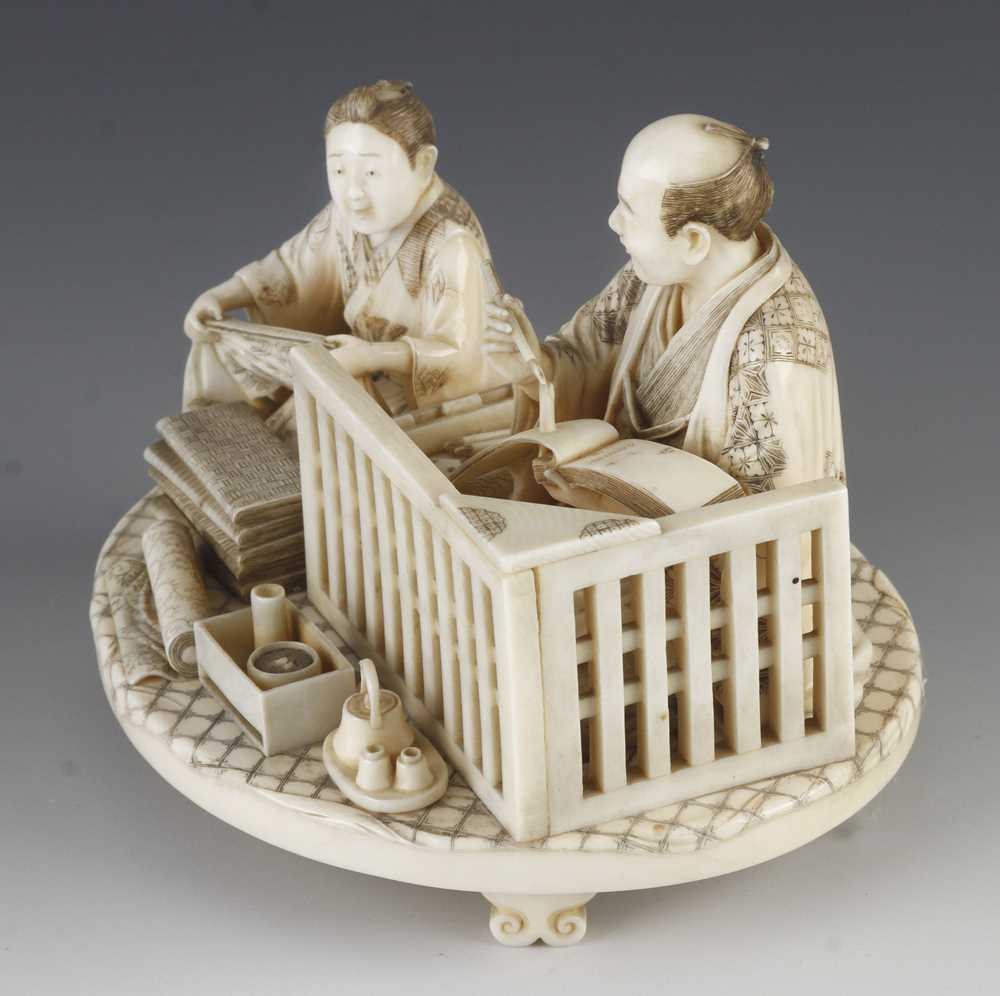 A fine ivory okimono of a draper taking notes as his apprentice measures the cloth 5" x 4" - Image 2 of 5