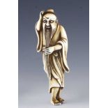 An 18c ivory netsuke of a Sage