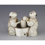 An ivory netsuke of two washerwomen