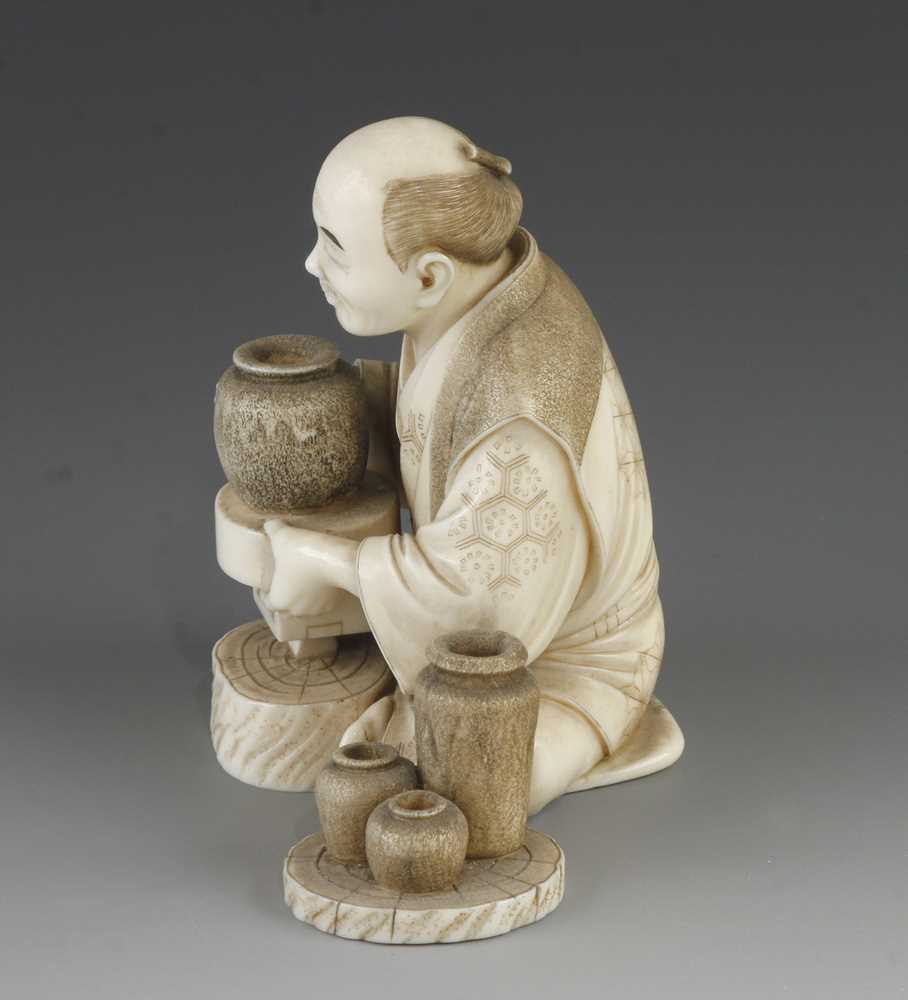 A 4" ivory okimono of a potter at his wheel - Image 2 of 5
