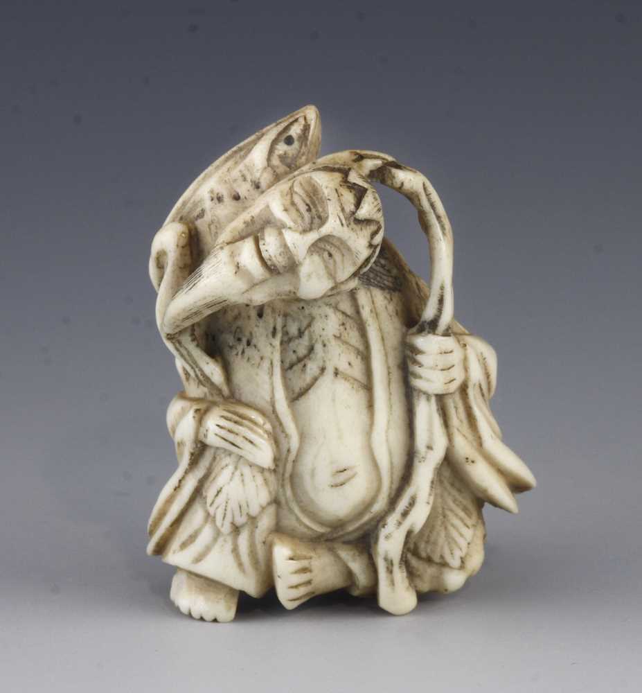 An ivory netsuke of Senin with frog