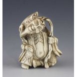 An ivory netsuke of Senin with frog