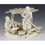 An ivory okimono of two carpenters building a sedan chair 6" x 4"h