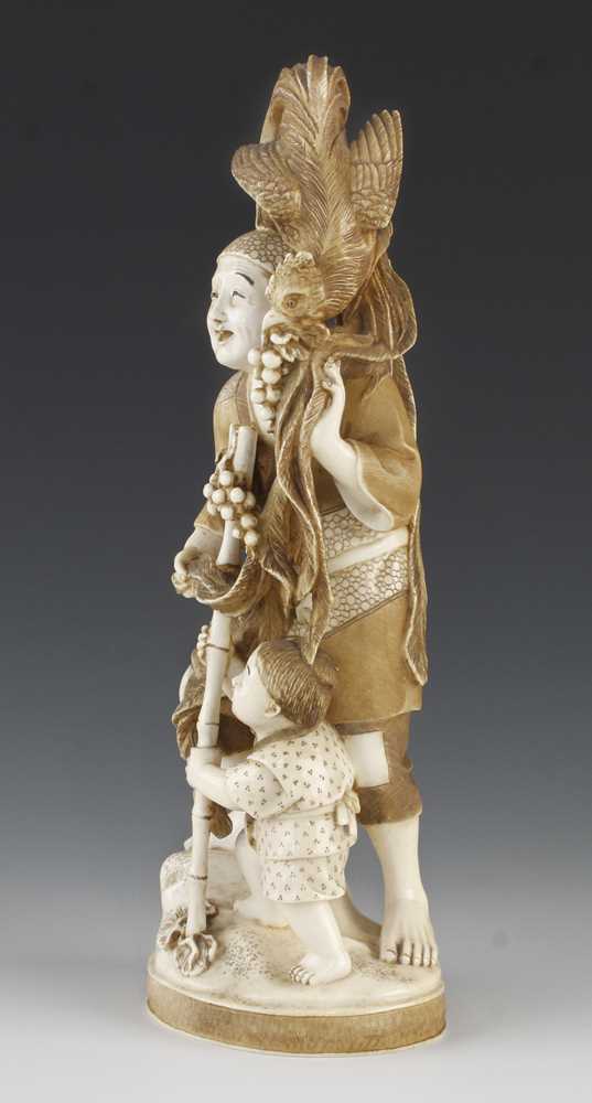 A 9" ivory okimono of a long tailed bird stealing grapes from a father and son - Image 4 of 5