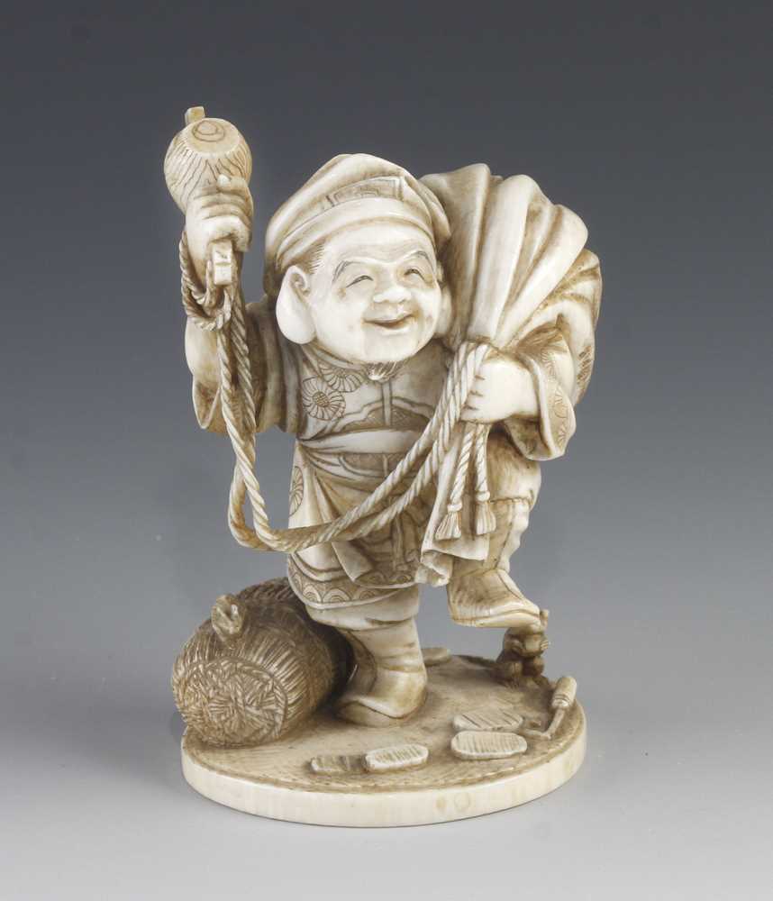 A 3 1/2" ivory okimono of Daikoku by Masayuki