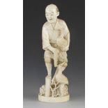 A 9" ivory okimono of a fisherman with two cormorants signed Munehide