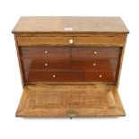 A lockable oak chest 20" x 8" x 12 " with six mahogany drawers G+