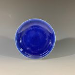 A Chinese blue glazed porcelain dish, Qianlong mark and period, diameter 19.7cm. Provenance: from