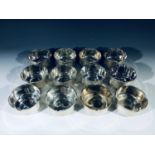 A set of twelve Egyptian silver bowls, with hallmarks, each with a shaped top rim, height 6.2cm,