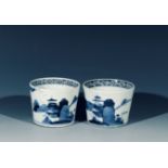 A pair of Japanese blue and white soba-choko cups, Edo period, each with a river landscape, height