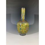 A Chinese cloisonne vase, 19th century, the yellow ground with scrolling flowering vines and