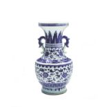 A Chinese blue and white porcelain vase, Qianlong, with a pair of shaped handles, the body with