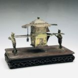 A Chinese white metal inkwell in the form of a sedan chair, late 19th century, signed beneath the