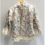 A Chinese white silk embroidered jacket, early 20th century, length 66cm. Provenance: from a