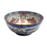 A Chinese porcelain punch bowl, Qianlong, 18th century, Dutch decorated, the exterior with three