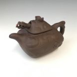 A Chinese Yixing teapot, the cover with a protruding dragons head, seal mark to base, height 8cm,