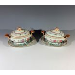 A pair of Chinese famille rose sauce tureens and covers, Qianlong period, with rococo scroll handles