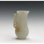 A Chinese Qing style white jade type archaic miniature jug, of baluster shape with an engraved