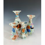 Two pairs of Japanese porcelain vases, red character marks, heights 21 and 16cm.