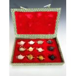 A set of Chinese miniature hardstone models of teapots, boxed.