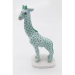 A Herend porcelain giraffe. Height 18.5cm .Condition report: No condition issues