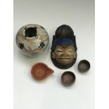 An African painted terracotta mask, height 12cm, two small Japanese bowls, an Arabic terracotta