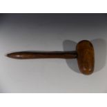 A Victorian fruitwood plumber's mallet. Length 34cm.
