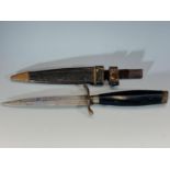 A German fighting knife, by Hugo Koller, Solingen, with horn grip and leather scabbard, 27cm.
