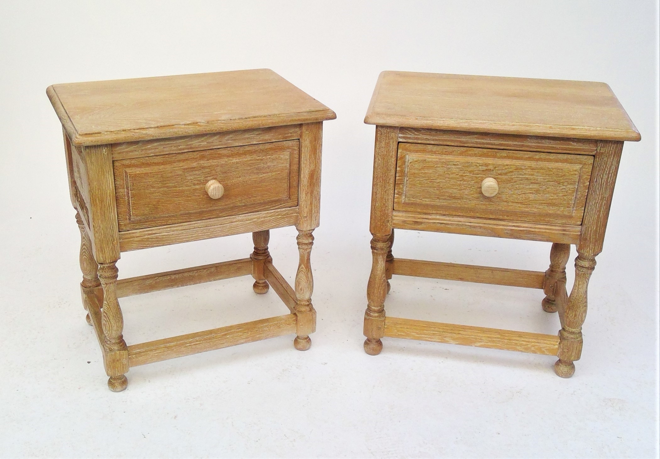 A pair of good French limed oak bedside tables by Christian Pingeon, height 61cm, width 56cm.