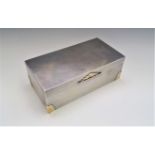 A good gold mounted silver cigarette box by Walker and Hall in bold Art Deco style Sheffield 1931