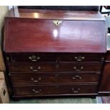 A George III mahogany bureau, the fall front opening to reveal a good fitted interior, above two