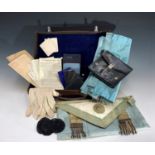 A Masonic regalia case, containing apron, gloves, booklets and ephemera.