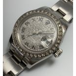 A ladies Rolex Oyster Perpetual Datejust wristwatch, with white gold diamond bezel and pave