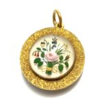 A fine Victorian high purity gold and Essex crystal locket with a panel of flowers. Diameter 24mm