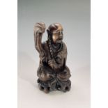 A Chinese carved wood figure of a seated Buddha, height 19.5cm.