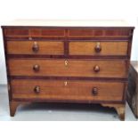 A George III oak and mahogany chest of drawers, with two short and two long drawers, on splay